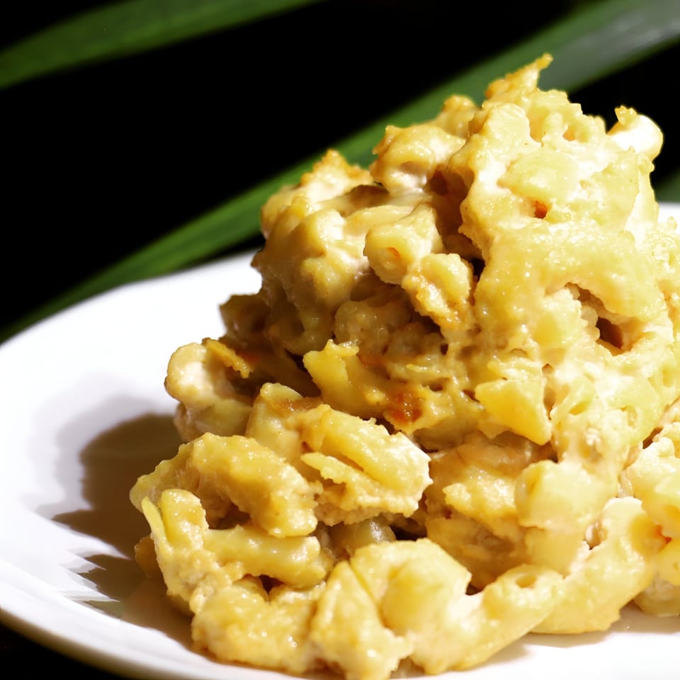 A close-up of The New Soul Veg's creamy vegan mac and cheese on a white plate.